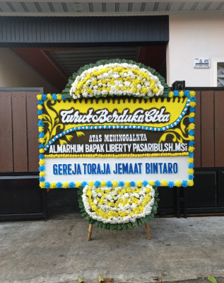Papan Bunga Duka di Wara Barat
